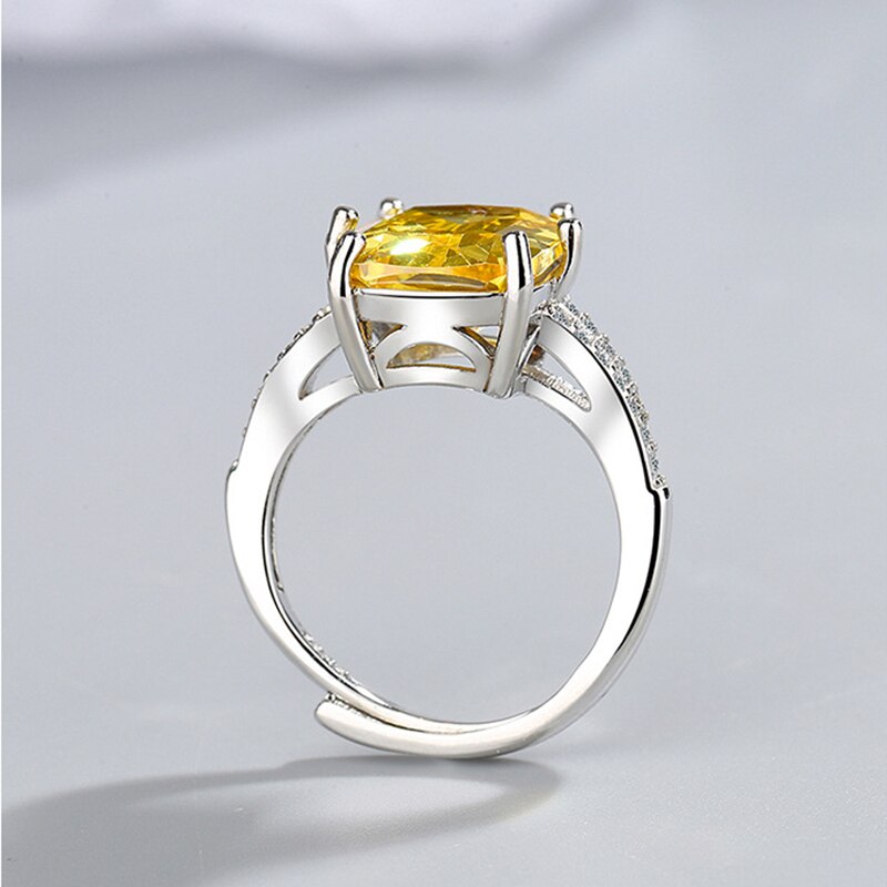 Simple but luxurious, this ring features a 2-carat Geometric Cubic Zirconia Width: of 12mm, surrounded by many micro CZ stones, and set in a 4-prong setting, looks pretty stunning and shiny. HIGH QUALITY - This ring has a brand-new crystal material that protects the environment, a highly polished surface made of copper metals, and an excellent electroplating process. To guarantee that it is lead- and nickel-free and hypoallergenic, we only utilize the best materials. Improve Your Wearing Experience.