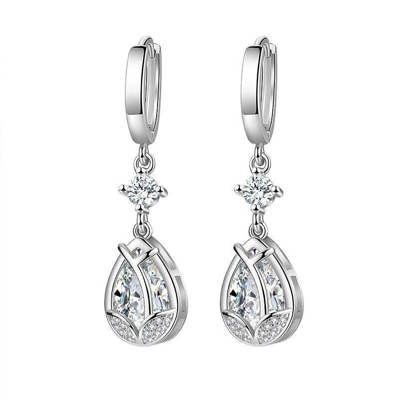 These earrings with a teardrop marking of S925 and a 925 stamp are exquisite and dazzling. They flawlessly blend the precision and excellence of cubic zirconia and crystal with a silver-tone plated setting