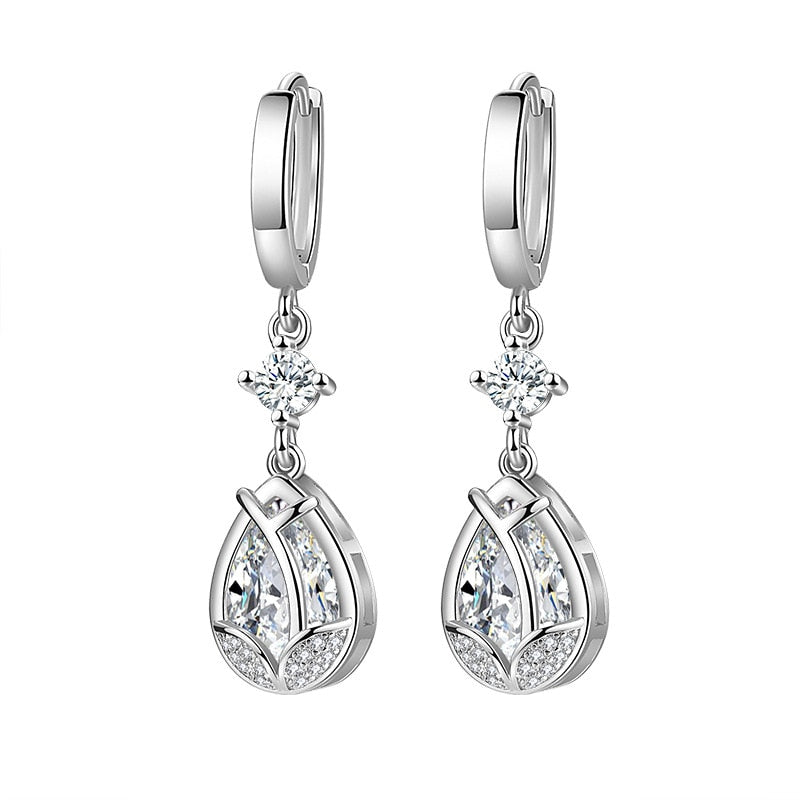 These earrings with a teardrop marking of S925 and a 925 stamp are exquisite and dazzling. They flawlessly blend the precision and excellence of cubic zirconia and crystal with a silver-tone plated setting